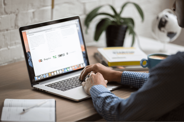 a person reading guidelines on a laptop