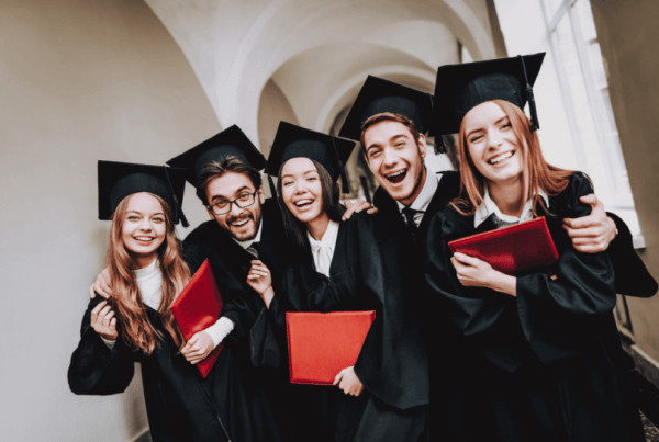 a group of people in graduation gowns and caps in UBC Outstanding Intl Student Award 2024