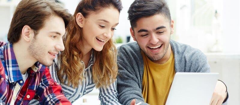 a person and person looking at a computer screen
