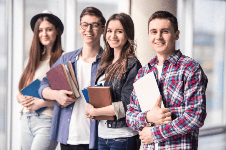 a group of people holding books