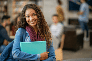 a person holding a blue folder